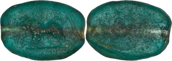 Ancient green glass intaglio featuring a carved boar motif, dated to the 1st-3rd century AD